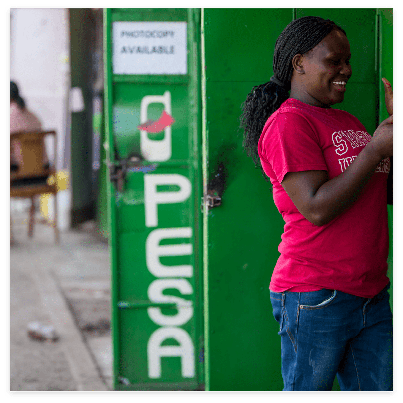 Vodafone Woman next to MPesa